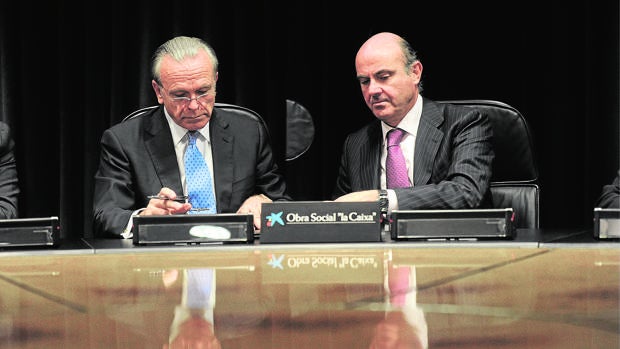 Isidro Fainé, presidente de Fundación la Caixa y Gas Natural, con el ministro de Economía, Luis de Guindos